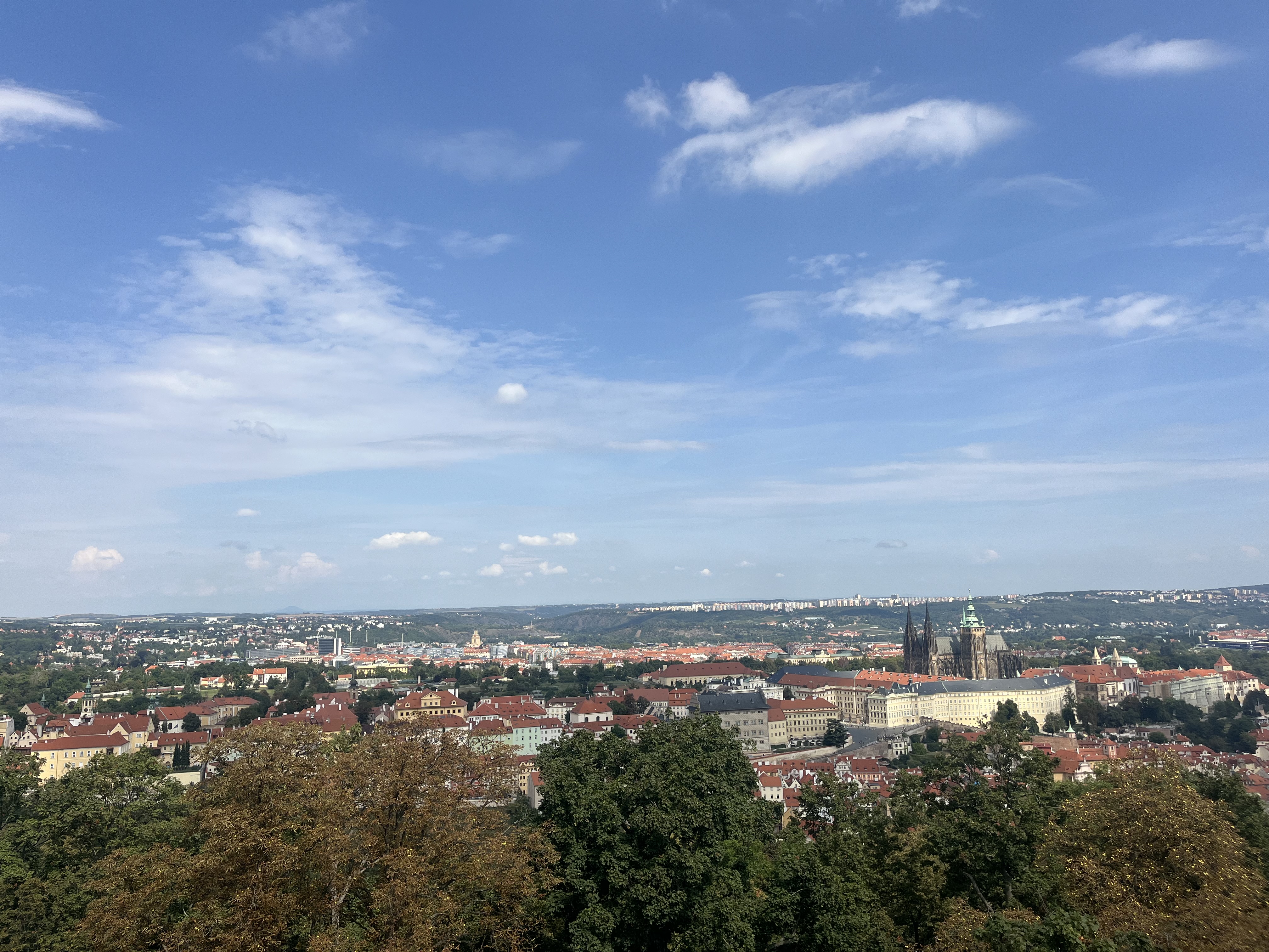 View over Prague rooftops and castle skyline from Petřín